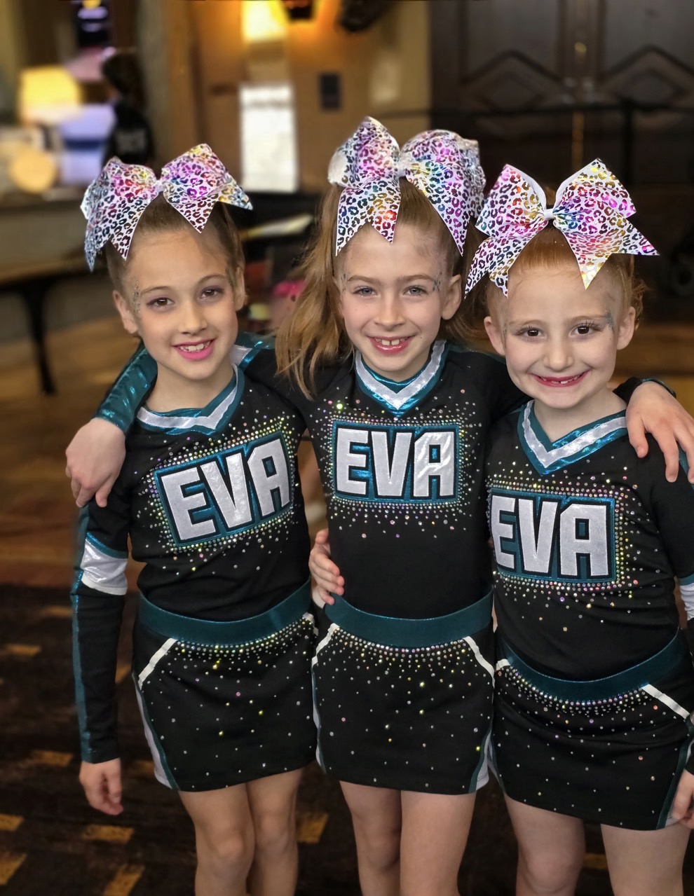 Three EVA athletes in uniform