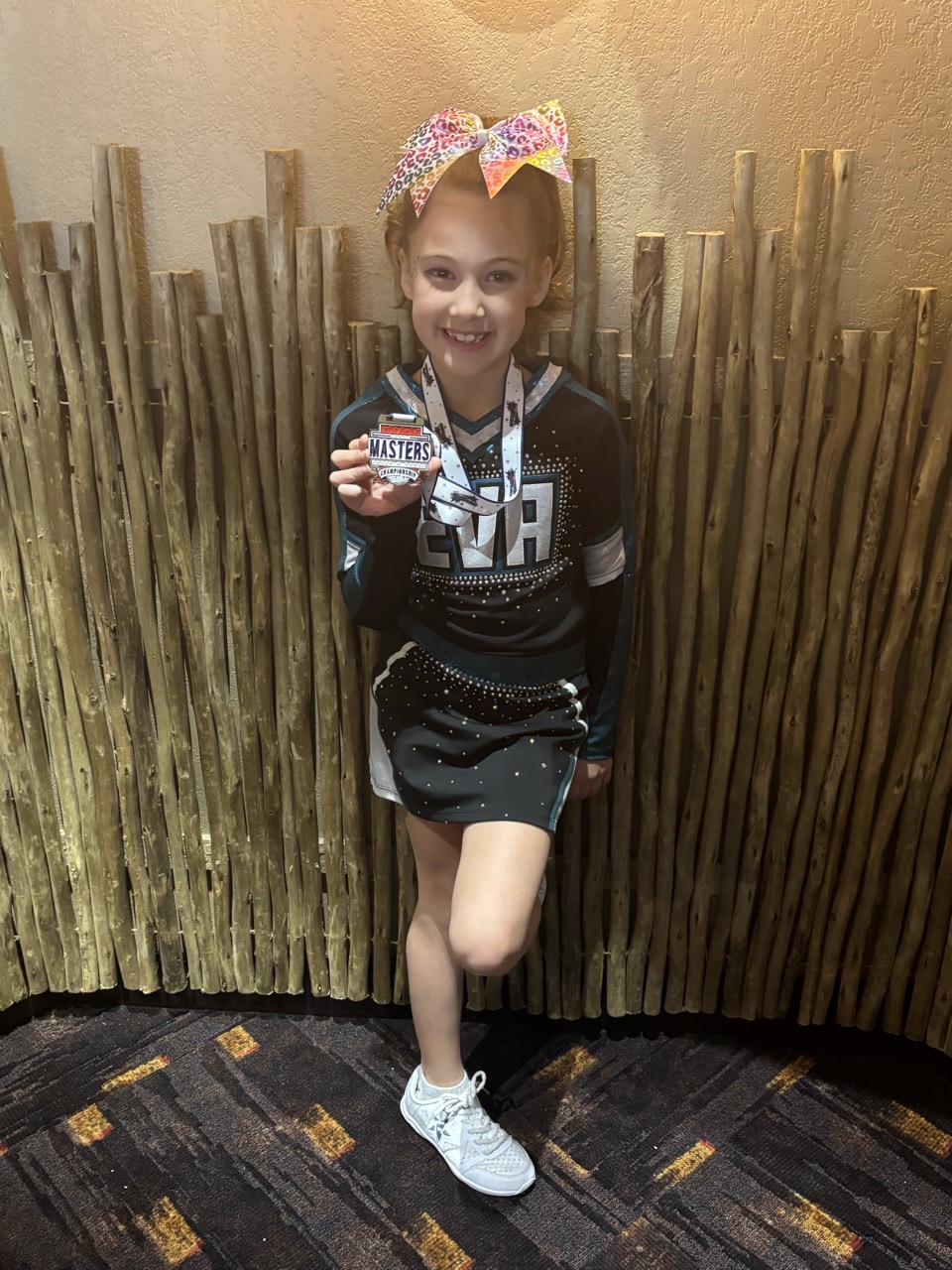 EVA athlete with her Masters Championship medal